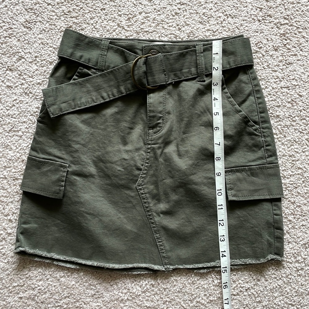 Army green skirt with frayed bottom edge. Size 0